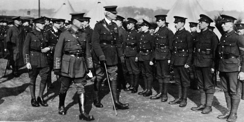 In August 1914, the British Secretary of State for War Lord Kitchener began his highly effective ‘‘Your Country Wants You’ recruitment campaign. Local pressure to take part led to the War Office agreeing in December 1914 that Jersey could contribute a contingent of Militiamen. Here the Island’s Lieutenant Governor, General Sir Alexander Rochford, inspects a group of Contingent volunteers.