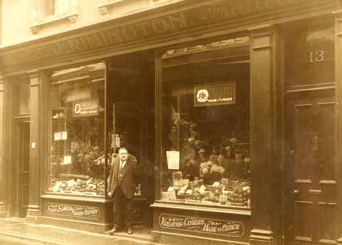 Jimmy Rimington outside his fruit and veg shop at No 13 King Street. The premises were built or remodelled for him in 1904. He was Jerripedia editor Mike Bisson's maternal grandfather