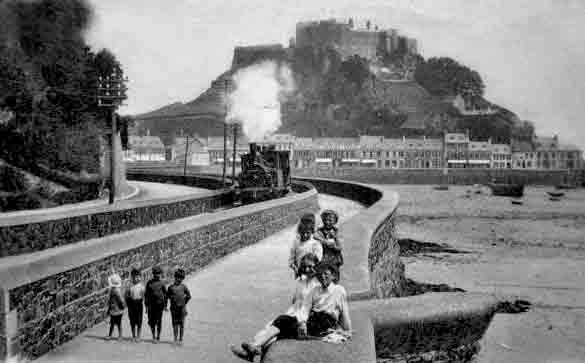 A train pulls away from Gorey with the castle in the background