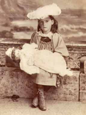 A girl and her doll in the 1880s