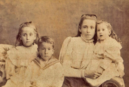 A mother and her children by Tynan Brothers