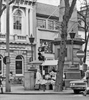A flower stall in front of the monument in the 1970s