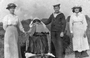 Siblings Olive, Pierre and Florence Moulin with an unknown old lady in a bath chair