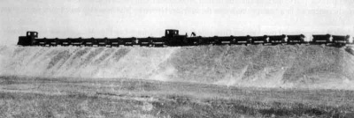Trains moving sand from Grouville Bay