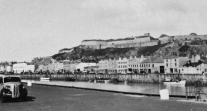 Commercial Buildings viewed from the New North Quay across the Old Harbour with Fort Regent above