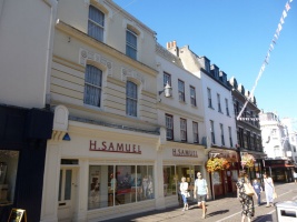 ... and a good mixture of ancient styles above relatively understated modern shopfronts looking down the street to ...