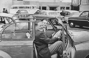 A convertible Morris Minor hire car greets Airport arrivals in the late 1950s