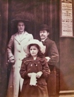 Jimmy and Connie Rimington, with their adopted daughter Doris, outside the entrance to 13 King Street