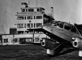 A de Havilland biplane in front of the Airport building