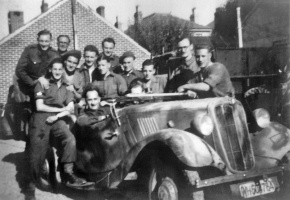 Liberating troops from the Royal Armoured Ordnance Corps in a Morris Tourer