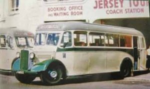 Note the rear entrance door of this JMT bus