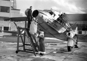 Father Christmas arrives by air in 1937