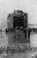 German prisoners embark on a landing craft