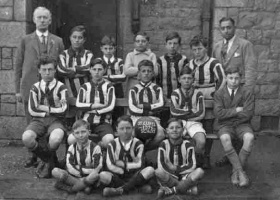 St Luke’s School football team pictured in 1926 with headmaster Thomas Stent and teacher Mr Anthony