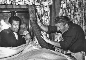 John Pertwee knocks over coins collected for charity in the early 1960s