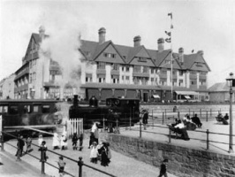 A train passes in front of the Grand Hotel at West Park