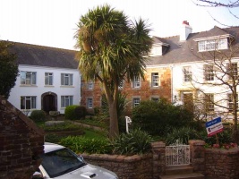 Andover Lodge, where the original St Peter shop was situated, 1810-1818. De Gruchy and his wife lived in the granite house. The white extension, built between 1795 and 1849, will have been the original 1810 drapery shop. To the left are the outbuildings from which de Gruchy conducted his general business in wine, timber, potatoes and flour