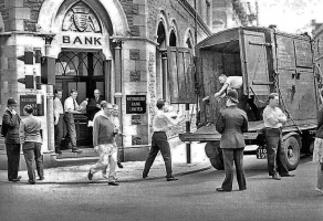 Loading bags of cash into a van outside Westminster Bank on the corner with New Cut in the 1950s