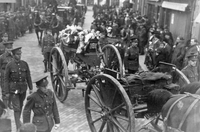 The funeral cortege with accompanying military procession for Corporal Walter Cheney of 3rd (Town) Battalion Jersey Militia passing through Charing Cross on 10 February 1915. After catching a chill while serving on outpost duty, the 26-year-old was eventually hospitalised with pneumonia before dying of the illness on 7 February.