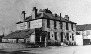 The Alexandra in 1944, with a German gun emplacement on the roof. The nearby church bell and weather vane of St Peter's Church was used for target practice