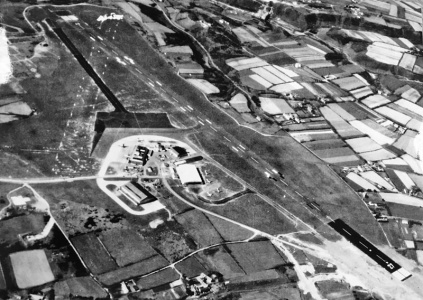 ... and the short grass landing strips used before the war have now given way to a longer runway aligned due east and west
