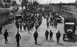 Royal Militia escort crew of HMS Jersey in 1939 visit