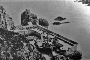 A paddle steamer inside Les Creux Harbour. How did it manage to get inside through the narrow entrance? 'It paddled' is the suggestion we received