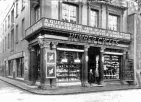 Picture from about 1920 by Albert Smith showing A Quenouillere's shop on the corner with Pitt Street offering a strange combination of jewellery and bicycles