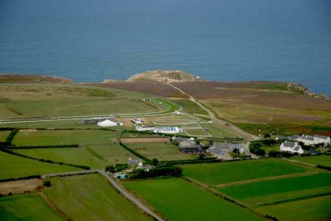 Les Landes racecourse with Grosnez Castle behind in 2006