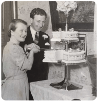 Raymond Tirel and Phyllis, nee Le Clercq, cut their wedding cake in 1940