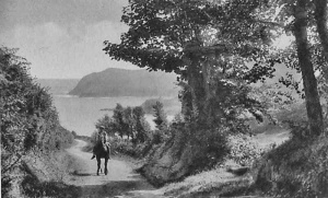 A horse and rider climb the narrow lane up from the bay which is now a main road