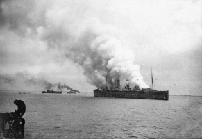 The Empress of Asia on fire after being attacked by 27 Japanese aircraft on 5th February 1942. Norman survived by jumping into the sea