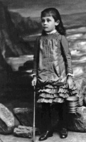 Louisa Hilda de Gruchy, as a child; apparently going low-watering