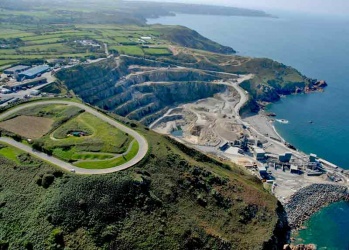 A 2007 picture of Ronez quarry, slowly eating its way into the north coast, with the loop of road on Sorel Point in the foreground, now used for kart racing