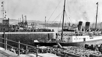 Isle of Jersey passes through the pierheads at St Helier Harbour