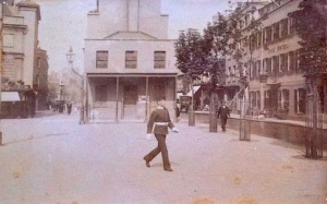1900 - a soldier crosses in front of the Piquet House