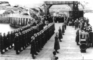 British troops on parade for the return of islanders in December 1945