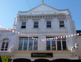 Waterstone's, Jersey's only surviving bookshop in the age of the Kindle, is a perfect example of the importance of looking up when wandering the streets of St Helier. Brett clearly did not, because he ignored what was behind him when in 1976 he noticed the datestone from the earlier building set in the facade of the recently completed modern retail block opposite. Perhaps nobody told him that the building in my picture was once the Grand Hotel du Calvados, which moved there after a devastating fire at its previous location in the Royal Square. And did Brett know that the two-storey building on the left was the General Post Office, from 1852 to 1881, before it moved to Grove Place?