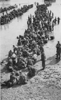 Lines of Germans waiting on the beach