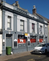 Why not start at a pub? The Aurora in Cattle Street. It's been there since 1858, and the Caesarea, next door, even longer. The frontage was altered to allow the street to be widened in the 1870s. Remarkably, save for the colour scheme, the Aurora has changed very little since then, from pavement to roof level. It may be unusual to have two public houses next door to each other, but it seems that hardly a street in the commercial heart of the town now lacks a row of several eateries of one sort or another