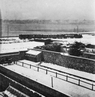 A train crosses St Aubin's Bay in the snow in 1909