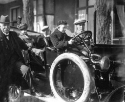 A Victoria College boy at the wheel of his father's car, photographed by Percival Dunham