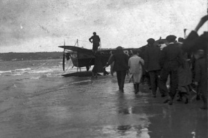 The first arrival, sea on one side, a growing crowd on the other