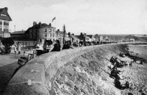 The seawall, solid granite blocks occasionally shifted by raging seas ...