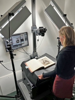 Toni uses an overhead camera which captures images from books