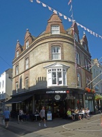 ... and the building on the opposite corner is a gem, from pavement level to the original ornate dormer windows, via the traditional rounded corner and octagonal section bay window on the first floor