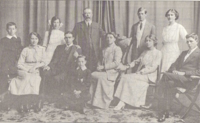 De Gruchy family of South Africa (circa 1914). Standing: Harold Linklater de Gruchy, Constance Havergill de Gruchy, Frederick Abram de Gruchy (father), Albert Philip de Gruchy, Gladys Mary de Gruchy. Seated: Doris Lillian de Gruchy, Frederick de Quetteville de Gruchy, Ivor Alan de Gruchy, Mary Irish (mother), Ethel May de Gruchy, Aubin Ewald de Gruchy (Dr and Mrs de Beer, South Africa)