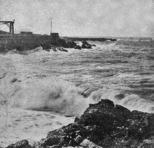 Rough seas batter the partly-completed pier