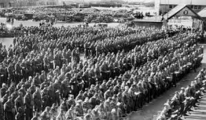 Large numbers of islanders and troops attended the drumhead service held at the Weighbridge on 25 August 1945