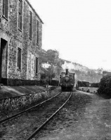 A train passes Brook House between Gorey Village and Gorey Pier